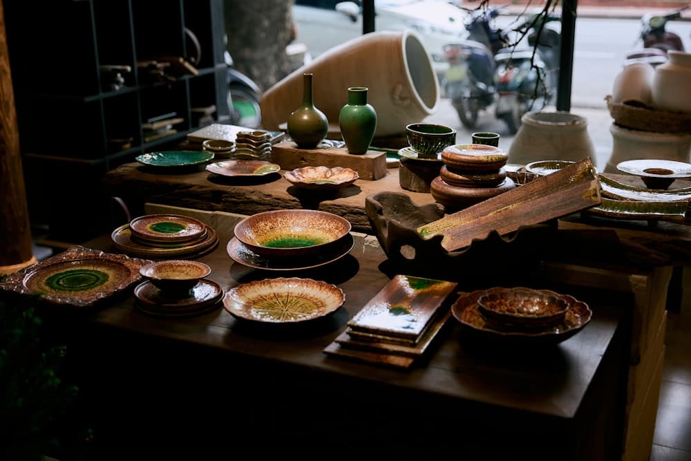 An assortment of ceramic bowls and vases on display